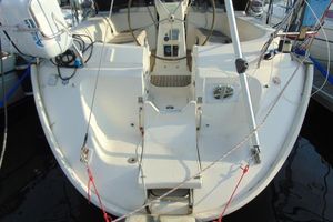 Bavaria 42 Cockpit view of a 1999 Bavaria 42 sailboat, featuring steering wheel and deck equipment.