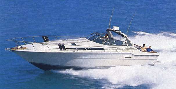 Sea Ray 460 Express Cruiser 1986 Sea Ray 460 Express Cruiser speeding on open water.