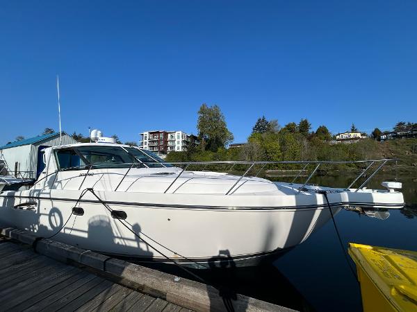 Tiara Yachts 3600 Sovran 2005 Tiara Yachts 3600 Sovran docked, reflecting on calm water under clear blue sky.