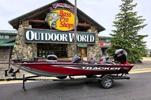 Tracker Pro Team 190 2025 Tracker Pro Team 190 boat displayed outside Bass Pro Shops Outdoor World.