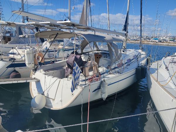 Bavaria 38 Cruiser 2008 Bavaria 38 Cruiser sailboat docked in a marina, featuring a spacious cockpit and canopy.