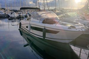 Jeanneau Cap Camarat 9.0 WA White Cap Camara 9.0 WA boat docked at marina, reflecting on calm water, 2019 model.