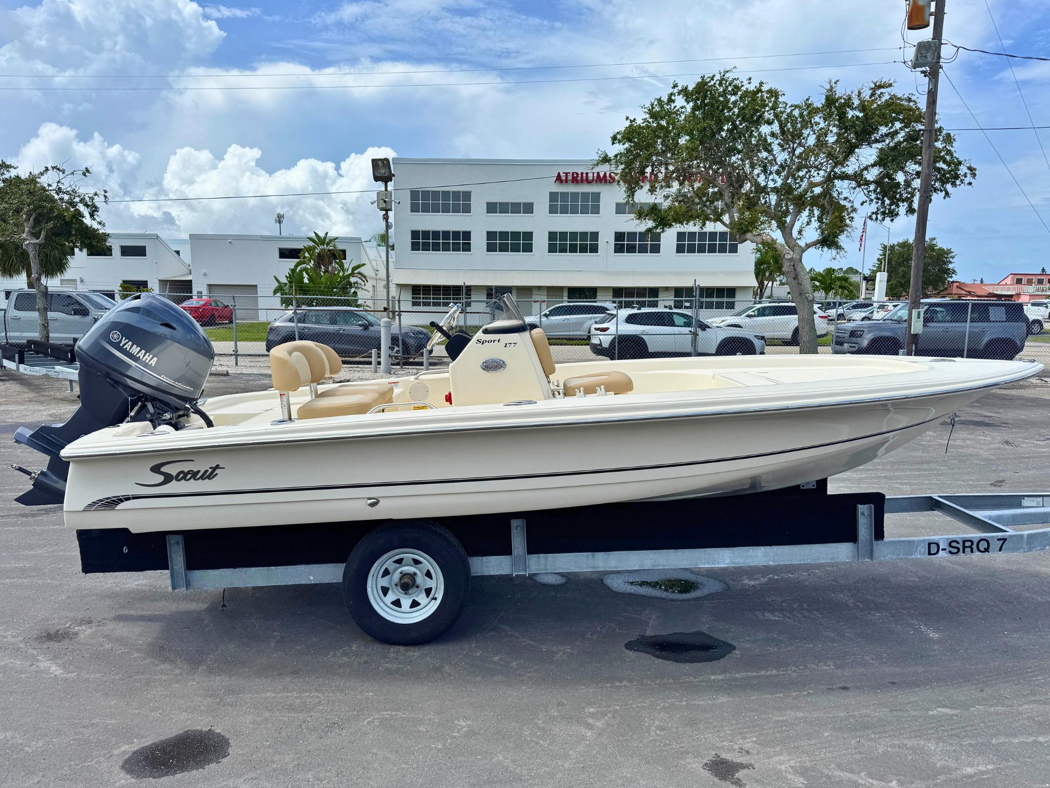 Scout 177 Sport 2026 Scout 177 Sport boat on trailer with Yamaha engine, parked outdoors.