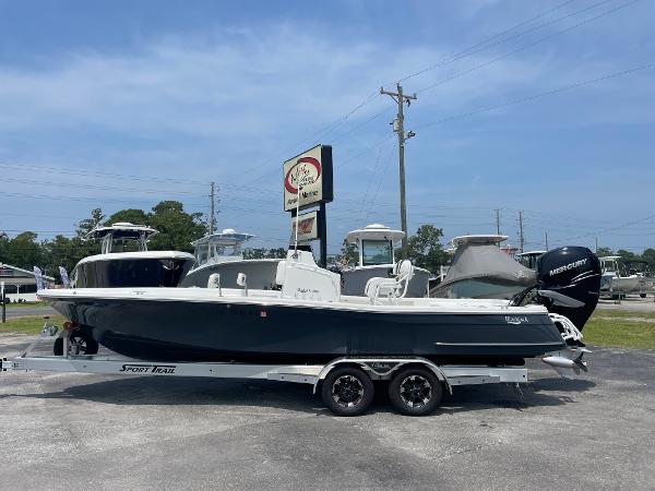 BlackJack 256 Bay 2023 BlackJack 256 Bay boat on a trailer at a dealership.