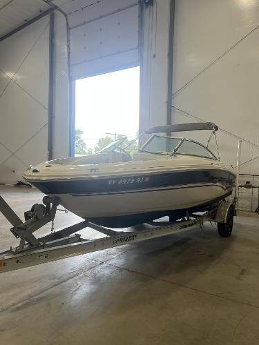 Sea Ray 200 Bow Rider 2002 Sea Ray 200 Bow Rider on trailer in indoor storage facility.
