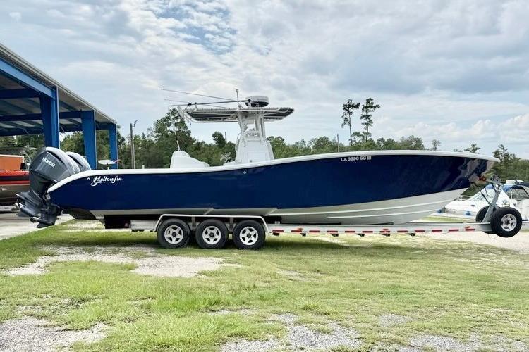 Yellowfin 36 Offshore 2006 Yellowfin 36 Offshore boat on trailer, parked outdoors.