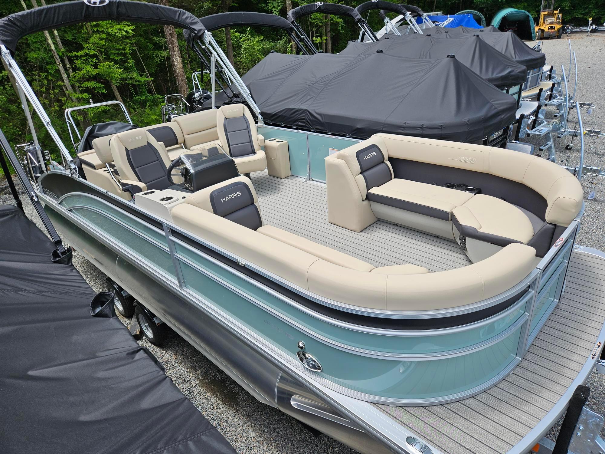 Harris Cruiser 230 2024 Harris Cruiser 230 pontoon boat with beige seating and sleek design.