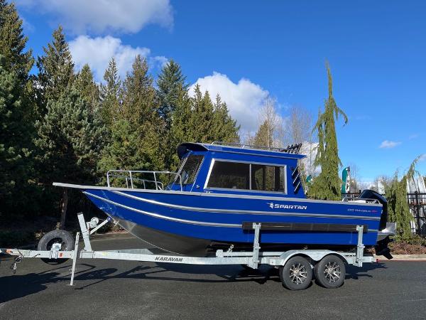 Spartan 220 Maximus 2024 Spartan 220 Maximus boat on trailer, blue exterior, parked outdoors.