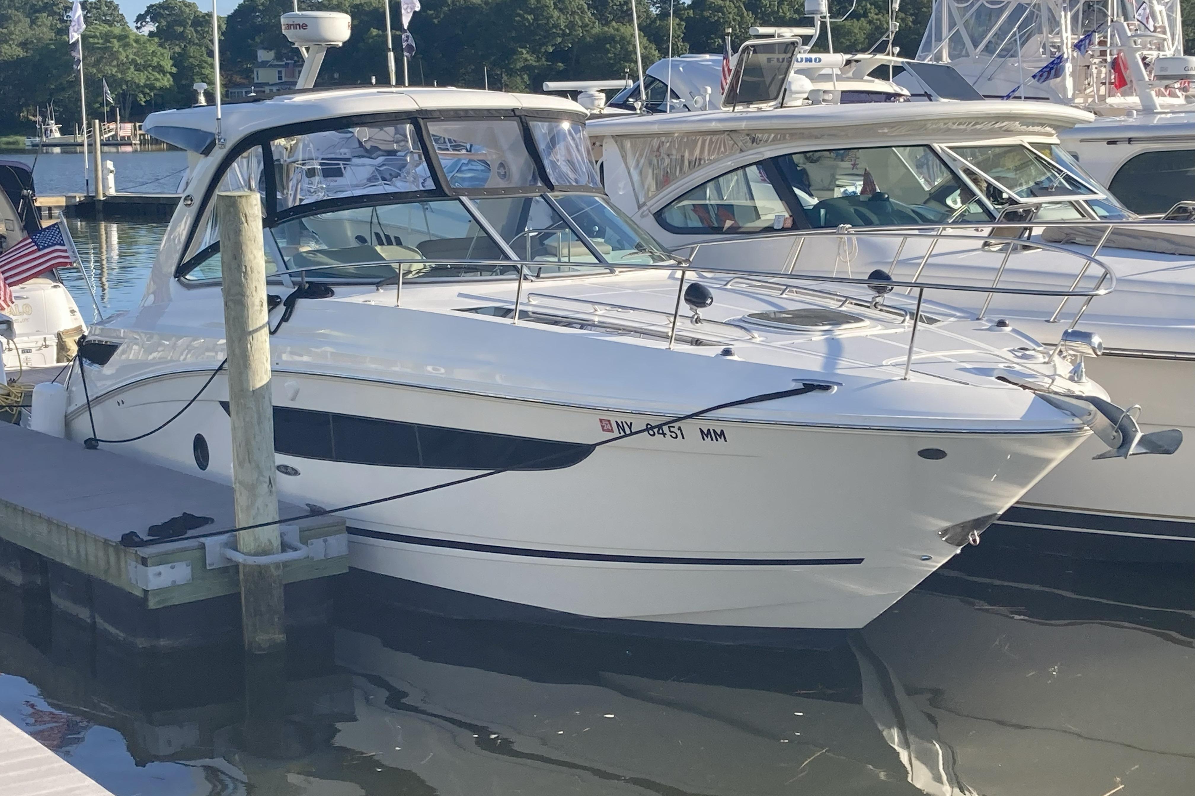 Sea Ray Sundancer 350 2017 Sea Ray Sundancer 350 yacht docked at marina, sunny day, calm waters.