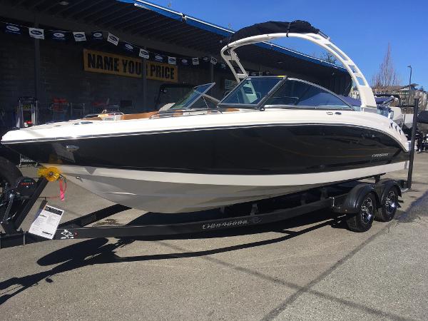 Chaparral 23 SSi 2025 Chaparral 23 SSi boat on a trailer, displayed outdoors.