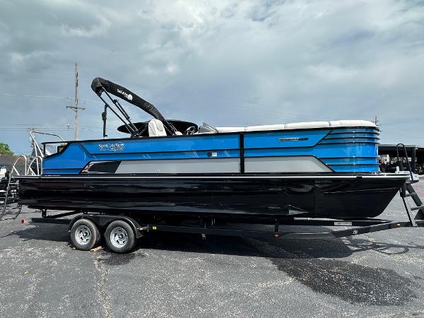 SunCatcher Elite 326 SL 2023 SunCatcher Elite 326 SL pontoon boat on trailer, blue and black design.