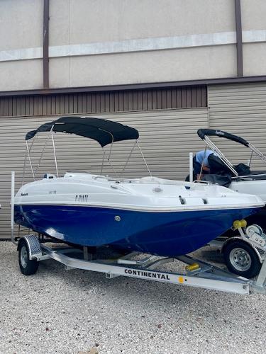 Hurricane SS188 2023 Hurricane SS188 boat on trailer, blue and white design, parked outdoors.