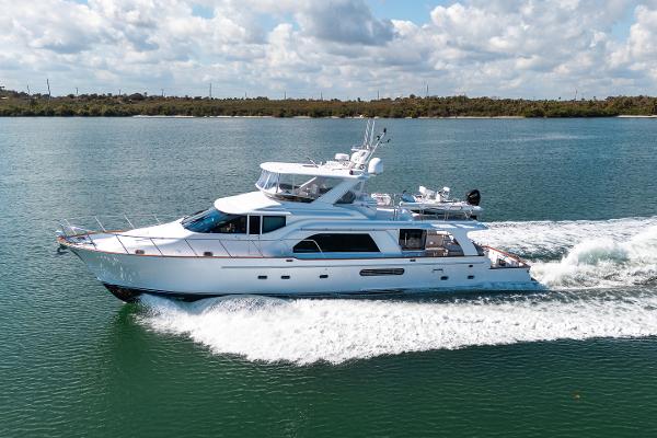 Queenship 72 Rayburn CPMY 2005 Queenship 72 Rayburn CPMY yacht cruising on a sunny day.