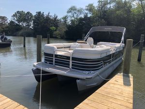 Godfrey Aqua-Patio 2200 Sport Tritoon 2010 Godfrey Aqua-Patio 2200 Sport Tritoon docked on calm water.