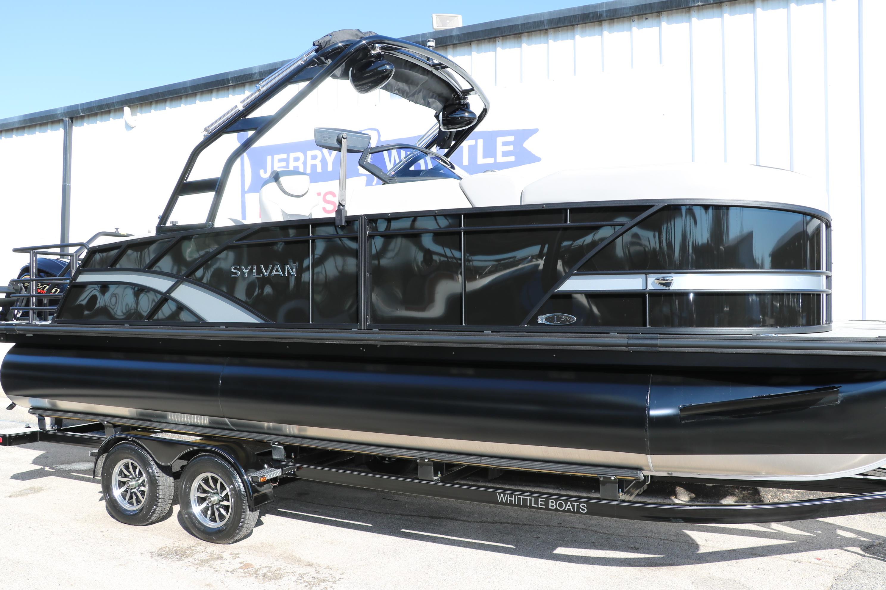 Sylvan L3 CLZ DH 2025 Sylvan L3 CLZ DH pontoon boat on trailer, sleek black design.