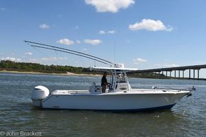 Sea Hunt Gamefish 30 2014 Sea Hunt Gamefish 30 boat on water, bridge in background, clear sky.