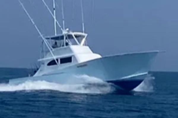 Custom Carolina Sportfish 2022 Custom Carolina Sportfish boat cruising on open water.