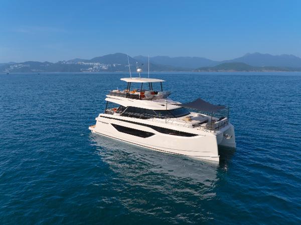 Prestige M48 Luxurious 2025 Prestige M48 yacht cruising on serene blue waters.