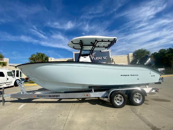 Cape Horn 24XS 2024 Cape Horn 24XS boat on trailer under clear blue sky.