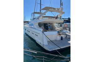 Ferretti Yachts 620 2003 Ferretti Yachts 620 docked at marina, showcasing elegant design and spacious deck.