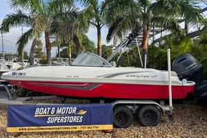 Starcraft MDX 210 OB 2019 Starcraft MDX 210 OB boat on trailer at dealership, surrounded by palm trees.