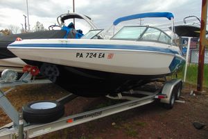 Regal 2000 ESX Bowrider 2016 Regal 2000 ESX Bowrider on trailer, blue and white design, parked outdoors.