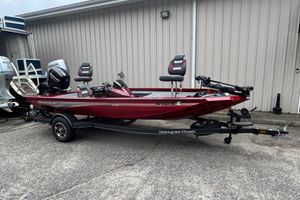 Ranger RT178 2024 Bass Tracker RT178 boat in red on a trailer, parked outdoors.