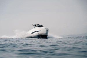 Kumbra 34 A sleek 2025 Kumbra 34 boat cruising swiftly on open water.