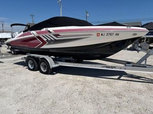 Regal 2000 ESX Bowrider 2016 Regal 2000 ESX Bowrider on trailer, red and white design, parked outdoors.
