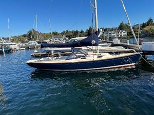 Alerion Express 33 2015 Alerion Express 33 sailboat docked in a marina under clear blue skies.