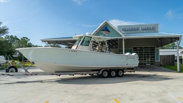 Sailfish 360 CC 2020 Sailfish 360 CC boat on trailer at dealership under clear sky.