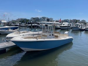 Sea Chaser 24 HFC 2023 Sea Chaser 24 HFC boat docked in a marina under clear blue skies.