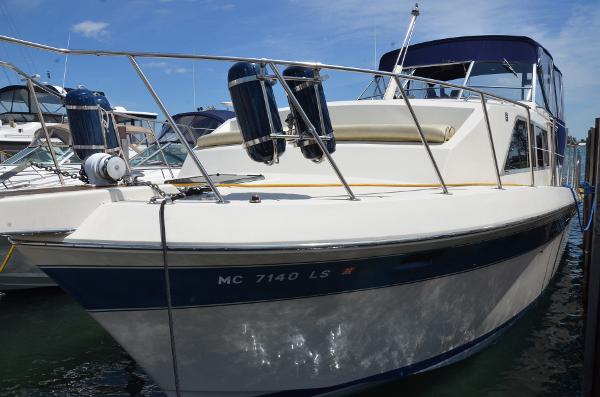 Chris-Craft 381 Catalina 1984 Chris-Craft 381 Catalina boat docked, featuring sleek design and blue accents.