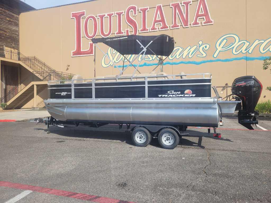 Sun Tracker SportFish 20 DLX 2025 Sun Tracker SportFish 20 DLX pontoon boat parked outside Louisiana building.