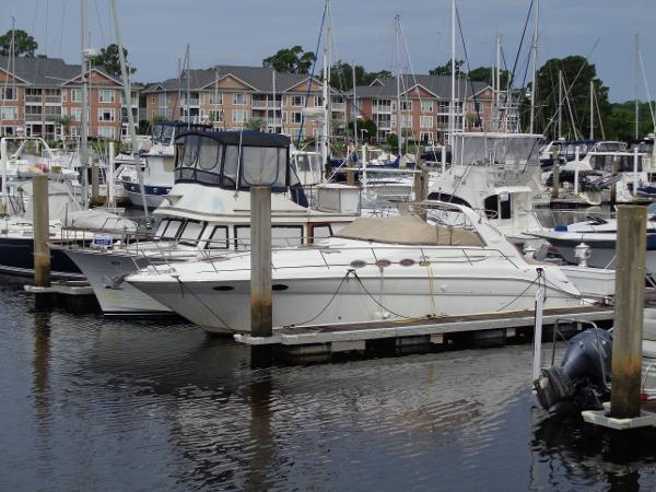 Sea Ray 370 Sundancer 1997 Sea Ray 370 Sundancer docked in a marina with other boats.