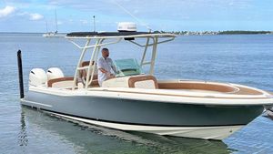 Chris-Craft Catalina 26 2016 Chris-Craft Catalina 26 boat on calm water with a person at the helm.