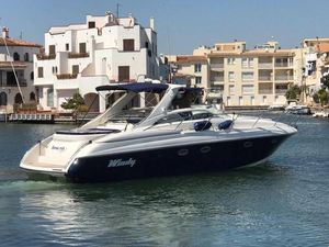 Windy Bora 40 2003 Windy Bora 40 yacht docked in a scenic marina with Mediterranean architecture.