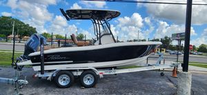 Pioneer 202 Islander 2025 Pioneer 202 Islander boat on trailer, black hull, parked outdoors under blue sky.