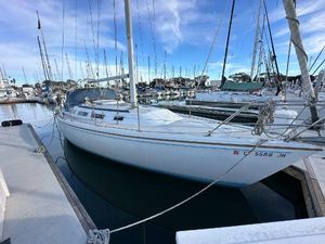 Catalina 36 1986 Catalina 36 sailboat docked in a marina under a clear blue sky.