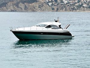 Pershing 50 2007 Pershing 50 yacht on calm water with coastal background.