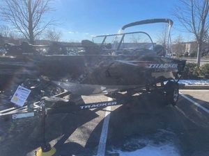 Tracker Pro Guide V-175 Combo 2025 Tracker Pro Guide V-175 Combo boat on trailer in parking lot.