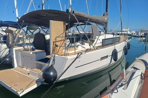 Dufour 460 Grand Large 2017 Dufour 460 Grand Large sailboat docked in a marina, featuring a spacious deck.