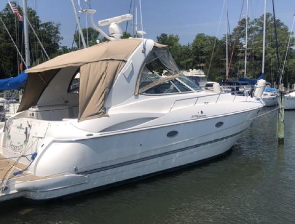 Cruisers Yachts 370 Express 2007 Cruisers Yachts 370 Express docked in a marina, featuring a sleek white design.