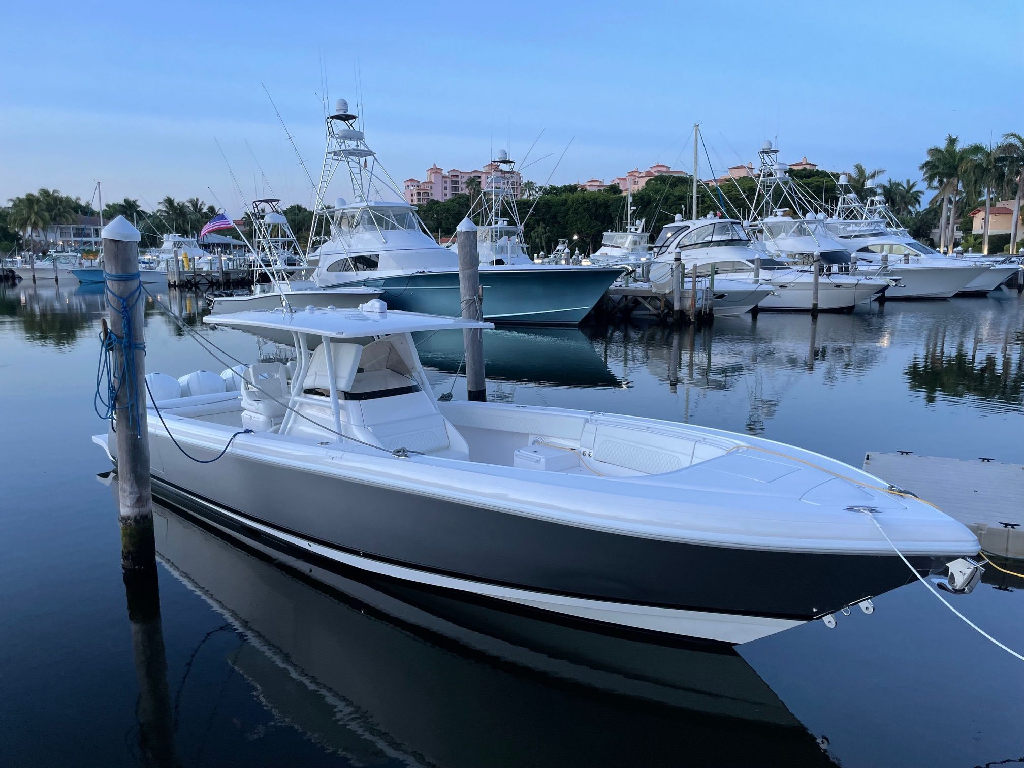 Intrepid 375 CC 2016 Intrepid 375 CC boat docked in a marina with other vessels.