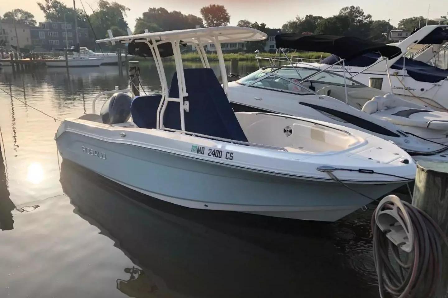 Robalo R200 Center Console 2016 Robalo R200 Center Console boat docked in a serene marina setting.