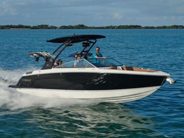 Cobalt R6 2025 Cobalt R6 boat cruising on clear blue water with passengers enjoying the ride.