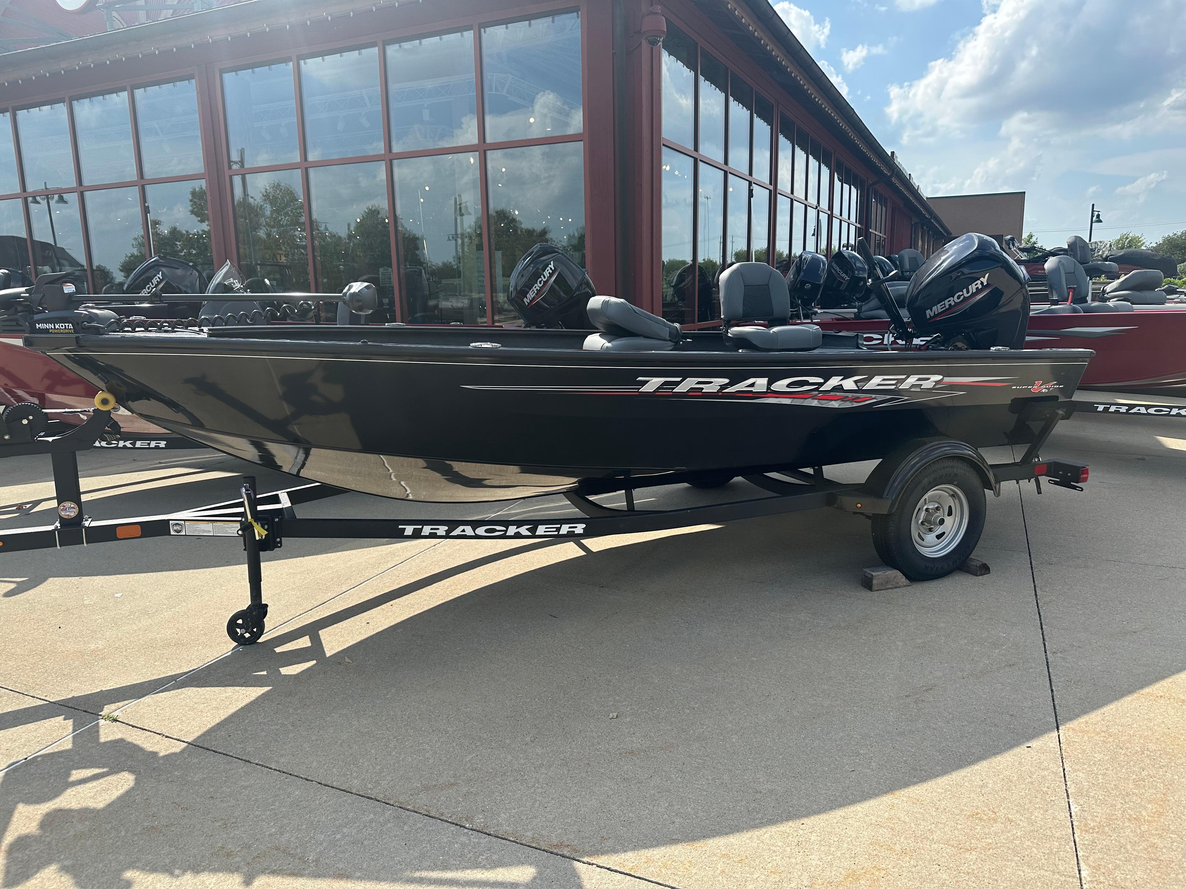 Tracker Super Guide V-16 T 2025 Tracker Super Guide V-16 T boat on trailer, parked outdoors.