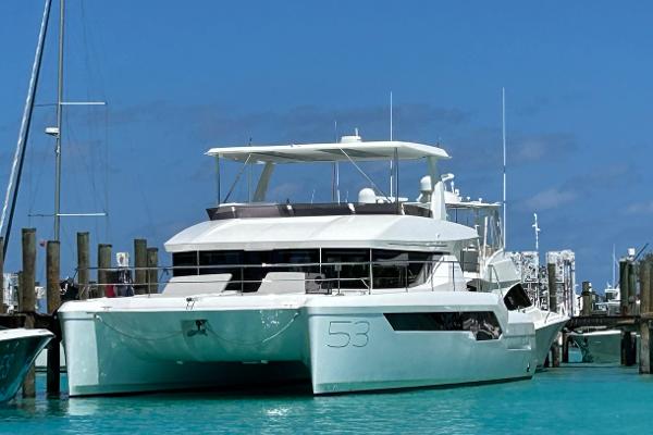 Leopard 53 Powercat 2024 Leopard 53 Powercat yacht docked in clear blue water.