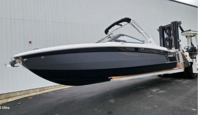 Cobalt R8 Surf 2025 Cobalt R8 Surf boat lifted by forklift, side view.