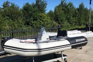 Zodiac Open 3.4 2023 Zodiac Open 3.4 inflatable boat on display outdoors.
